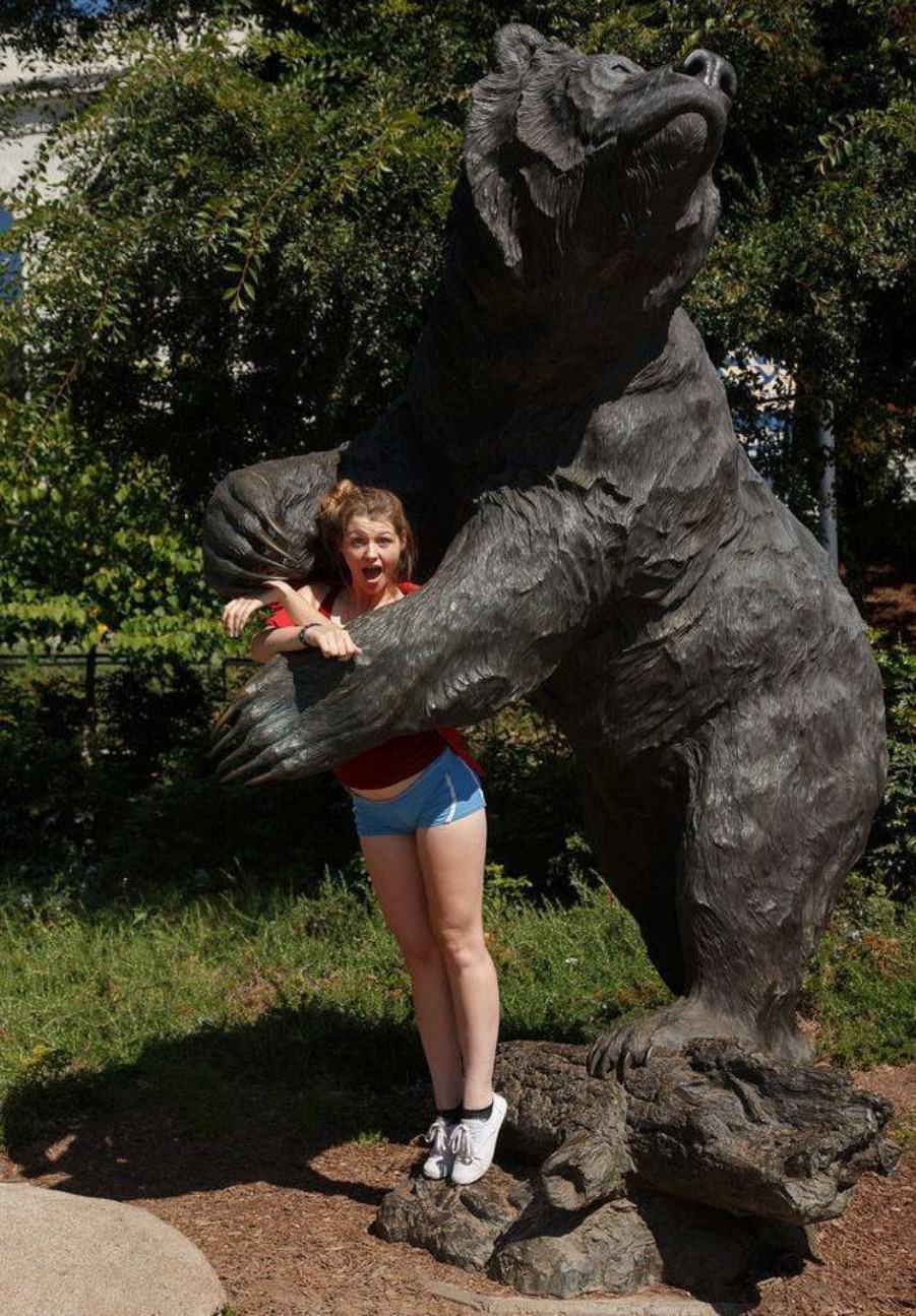 Posing with their favorite statues