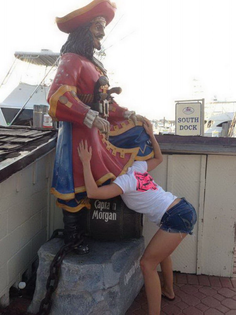 Posing with their favorite statues