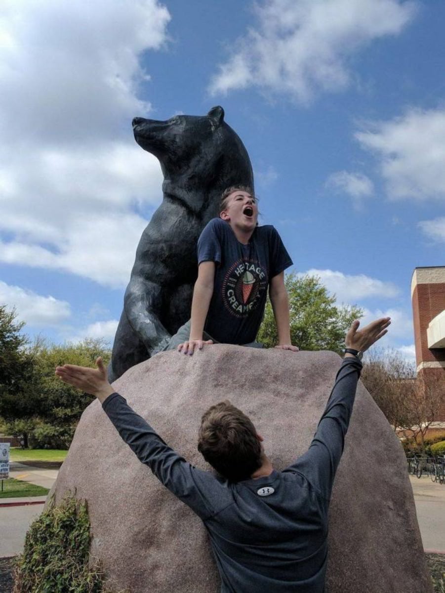 Posing with their favorite statues