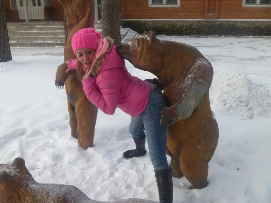 Posing with their favorite statues