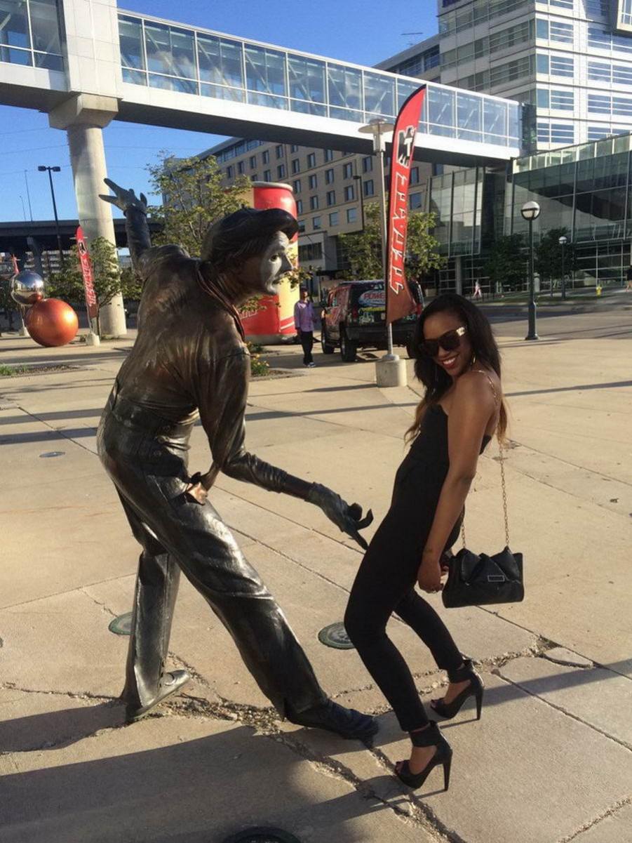 Posing with their favorite statues