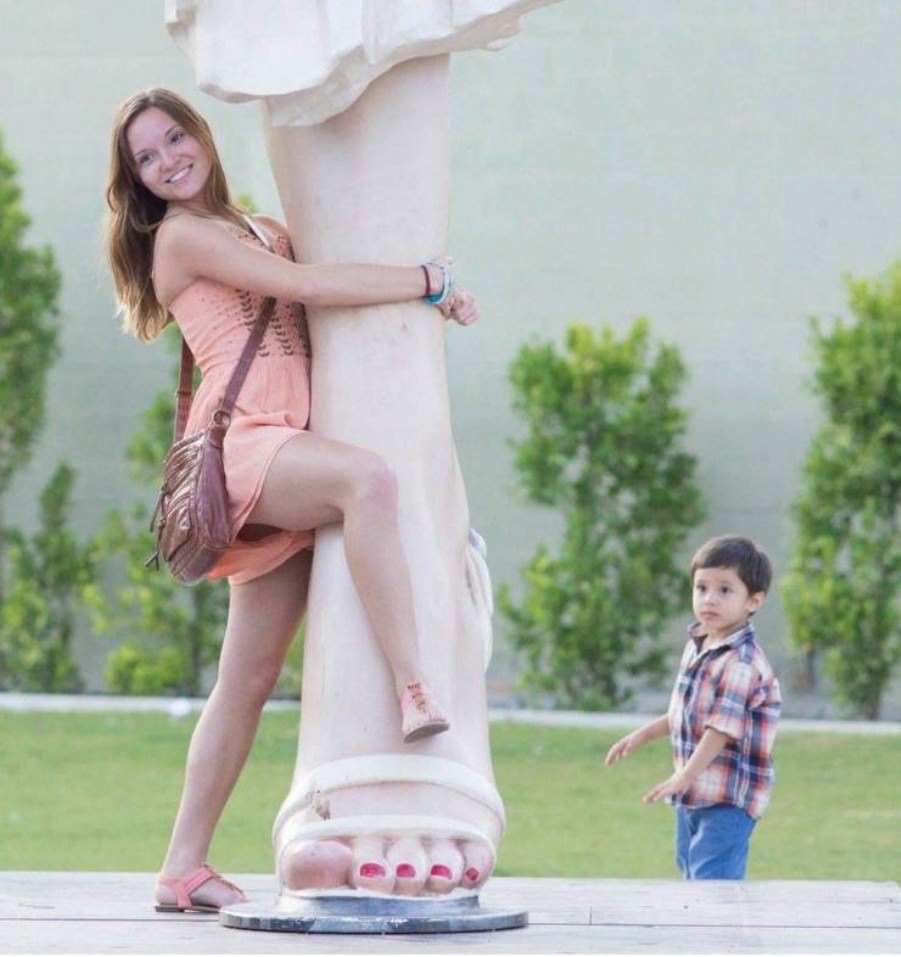 Posing with their favorite statues