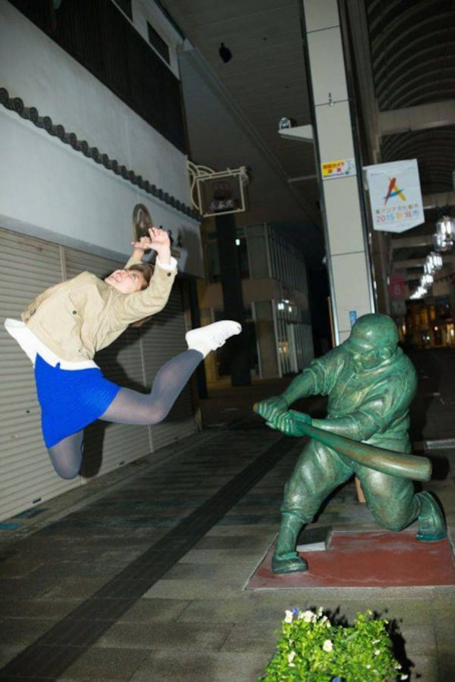 Posing with their favorite statues