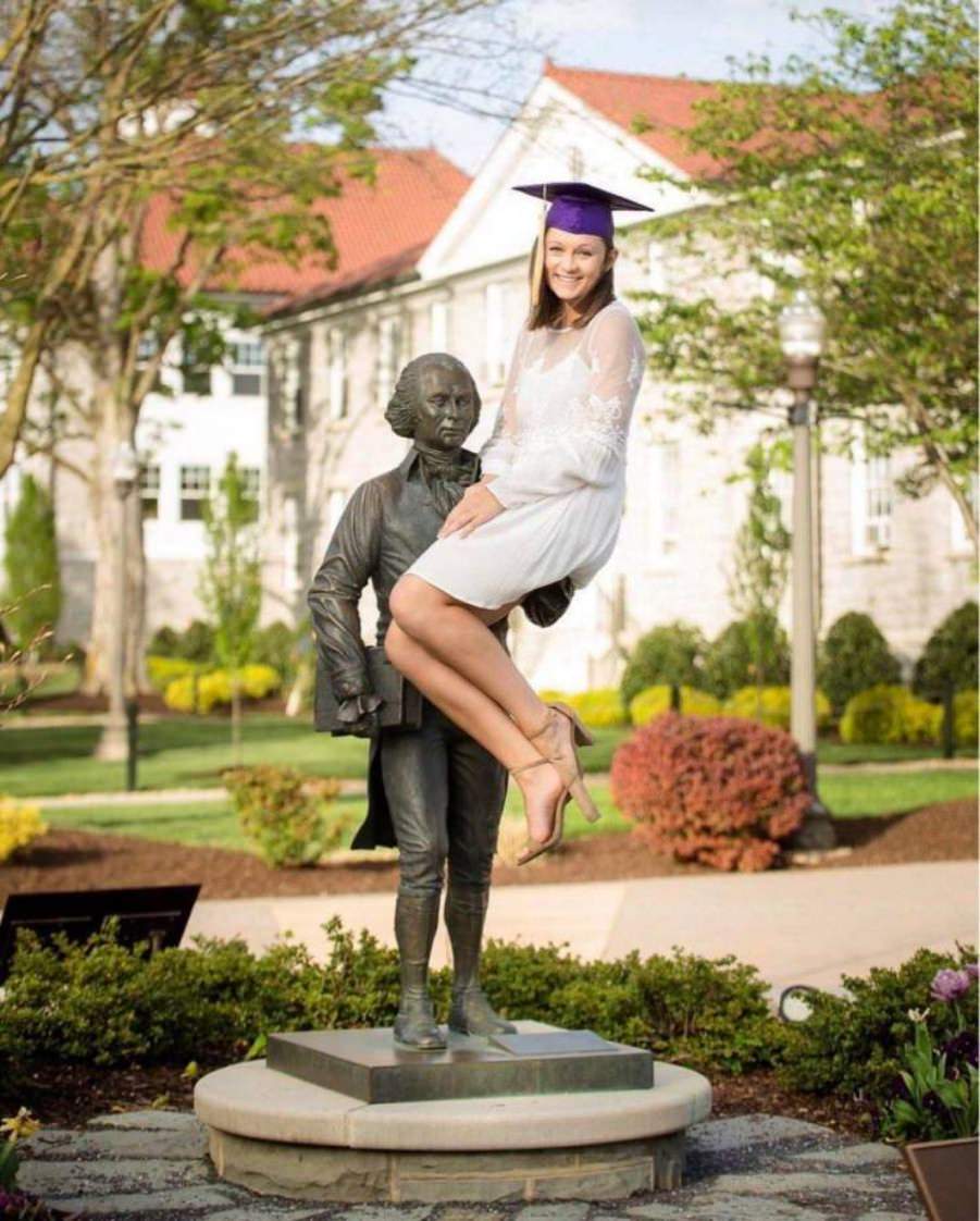 Posing with their favorite statues