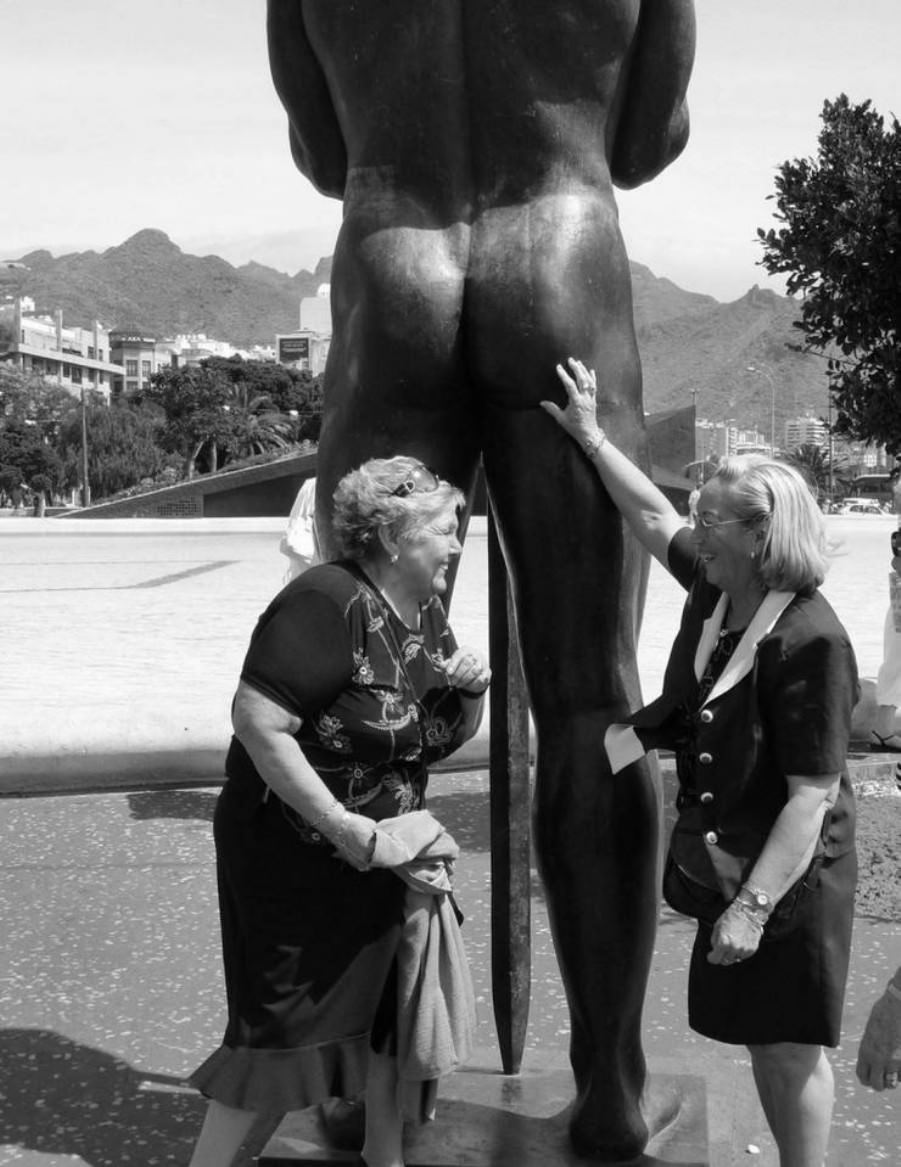 Posing with their favorite statues