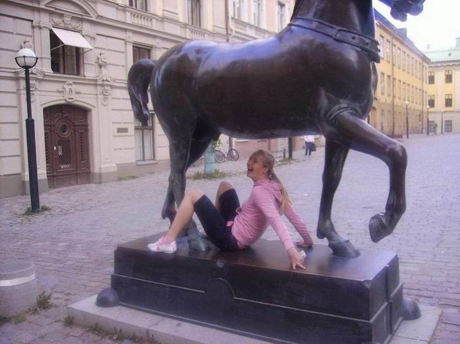 Posing with their favorite statues