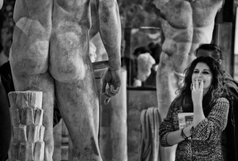 Posing with their favorite statues