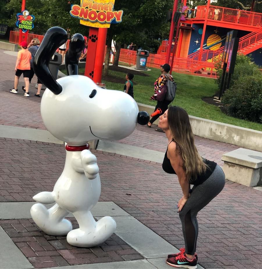 Posing with their favorite statues