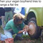 Tries To Change A Flat Tire